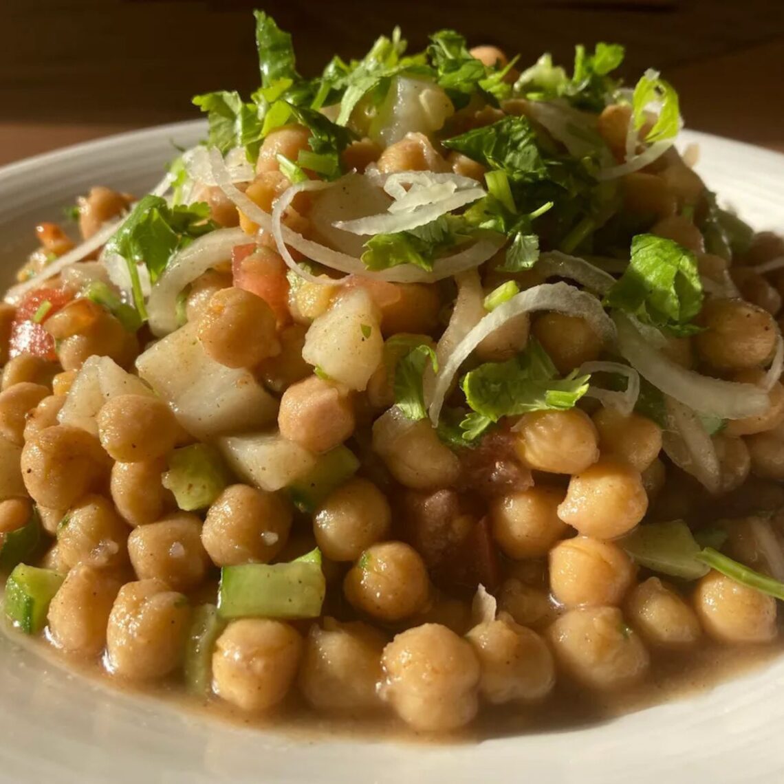 spicy tangy chickpeas chaat is served on a plate